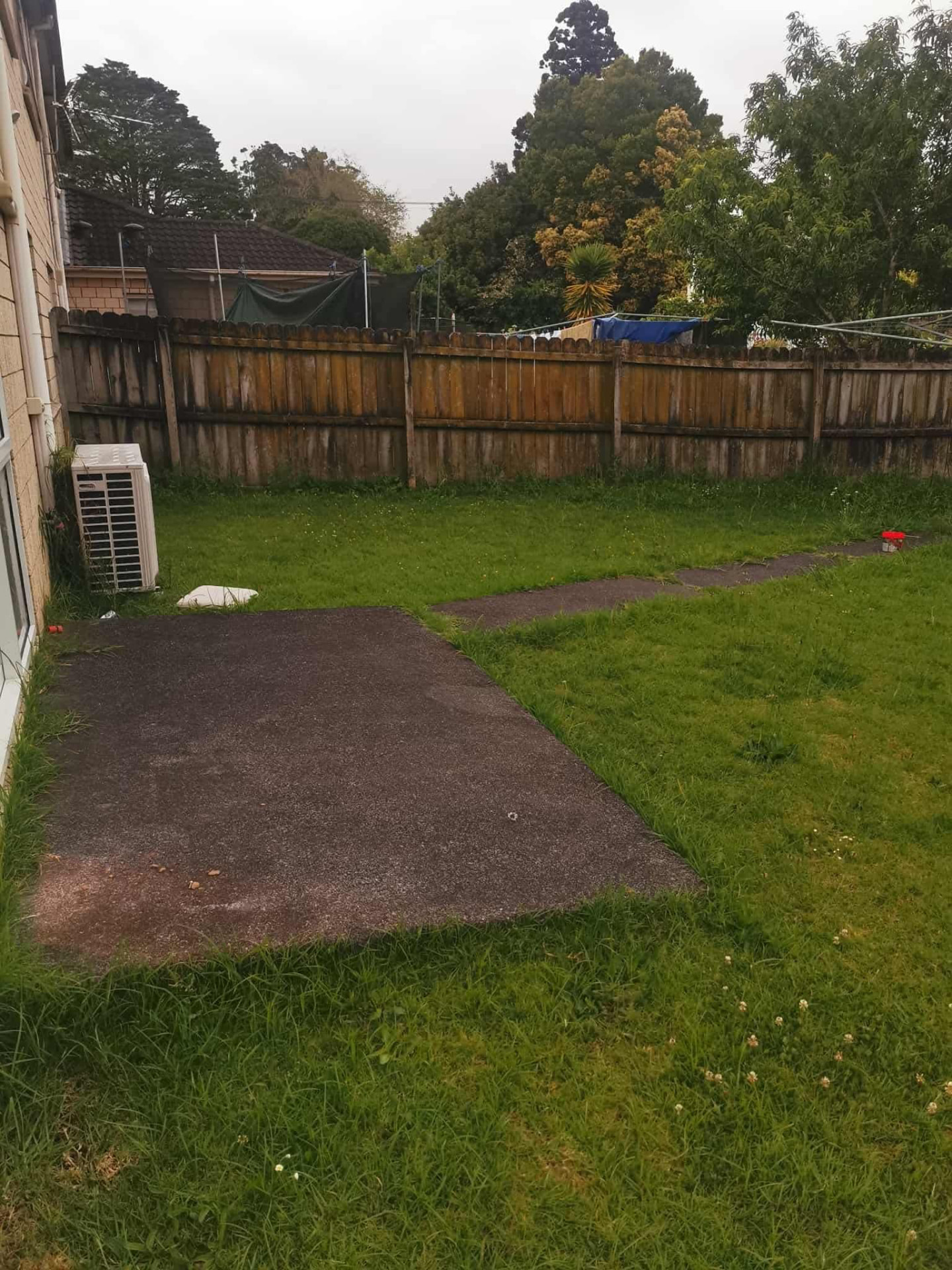 Backyard lawn and fence line maintained by Tauwhare Lawn Care Services